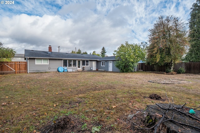 2936 Willakenzie Rd, Eugene, OR 97401 - back of house featuring a fenced backyard and a chimney