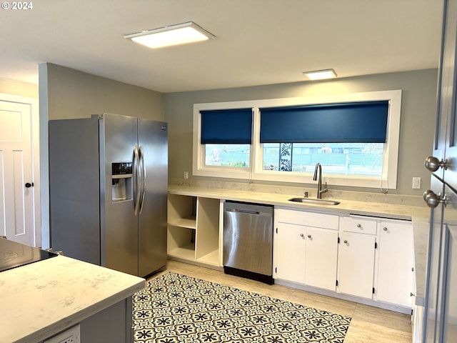 2936 Willakenzie Rd, Eugene, OR 97401 - kitchen with stainless steel appliances, white cabinetry, and light tile patterned floors