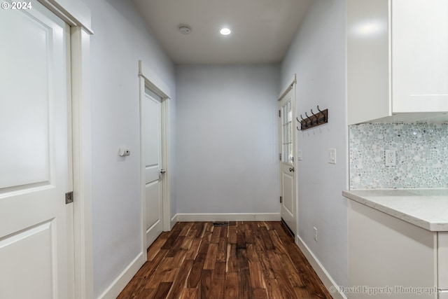 doorway to outside with dark hardwood / wood-style flooring