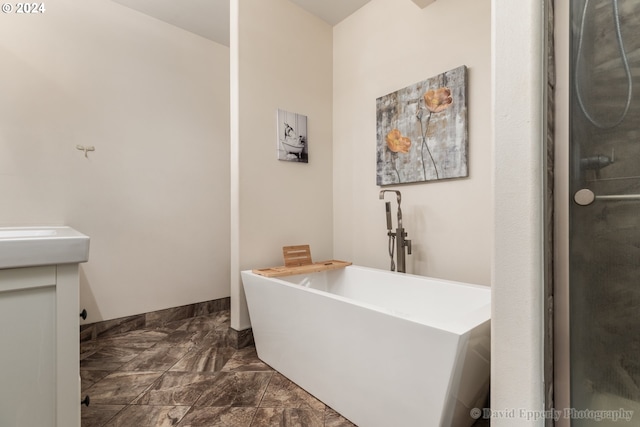 bathroom featuring vanity and plus walk in shower