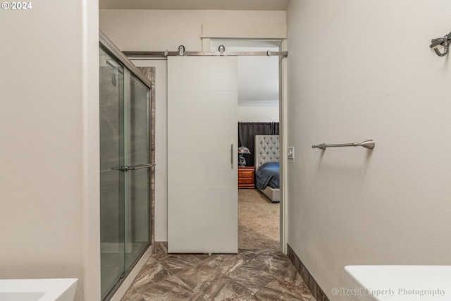 bathroom with a shower with shower door