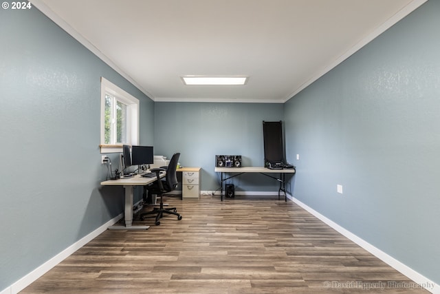 home office with hardwood / wood-style floors and ornamental molding