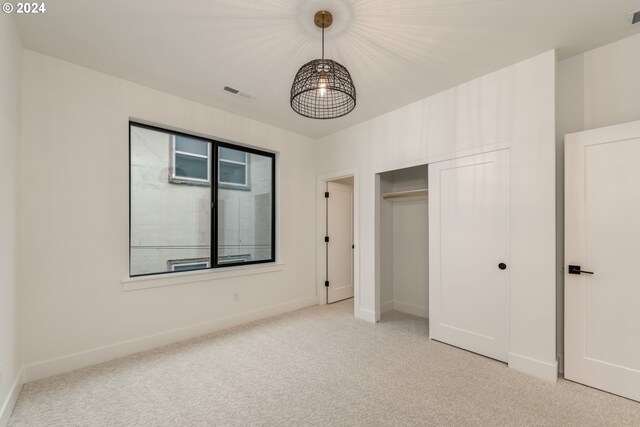 hallway with light hardwood / wood-style floors