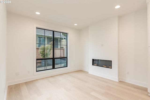 unfurnished living room featuring light hardwood / wood-style flooring