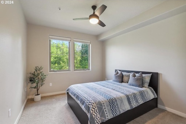 bedroom featuring ceiling fan and light colored carpet