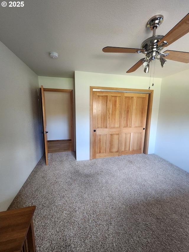 3413 Wild River Dr, Roseburg, OR 97470 - unfurnished bedroom with carpet, a ceiling fan, and a closet