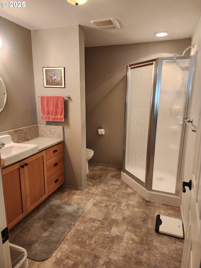 3413 Wild River Dr, Roseburg, OR 97470 - bathroom featuring a stall shower, vanity, and toilet