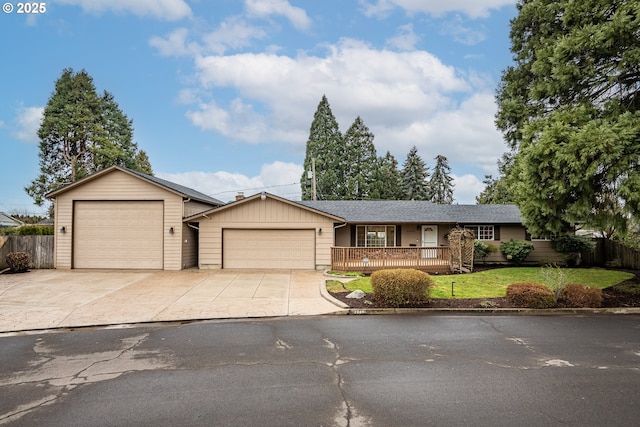 ranch-style home featuring a garage and a front lawn