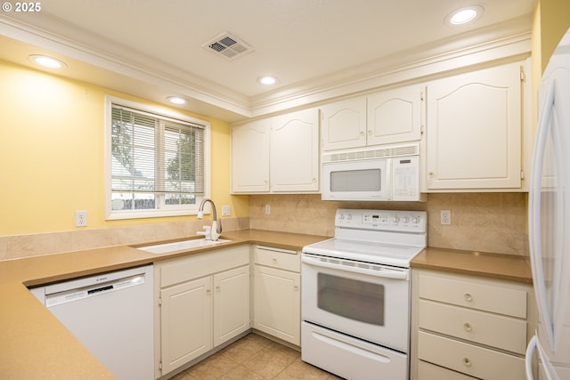 kitchen featuring sink, white cabinetry, light tile patterned floors, white appliances, and decorative backsplash