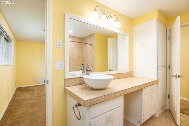 bathroom with tile patterned floors and vanity