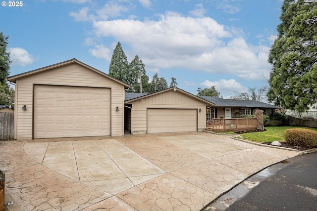 single story home featuring a garage and a front yard