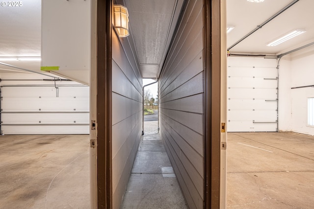 hall featuring concrete flooring