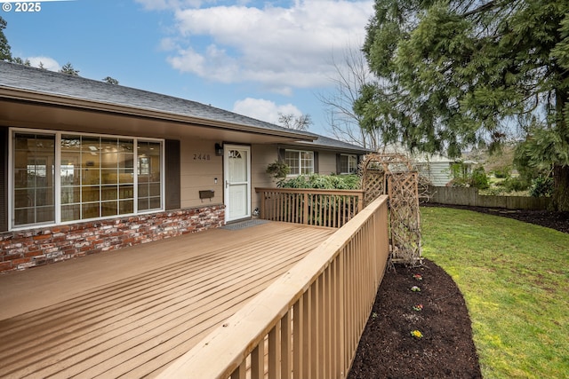 deck featuring a lawn