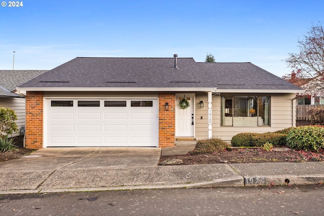 single story home with a garage