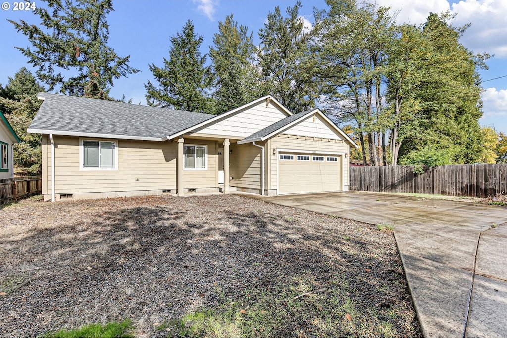 ranch-style home with a garage