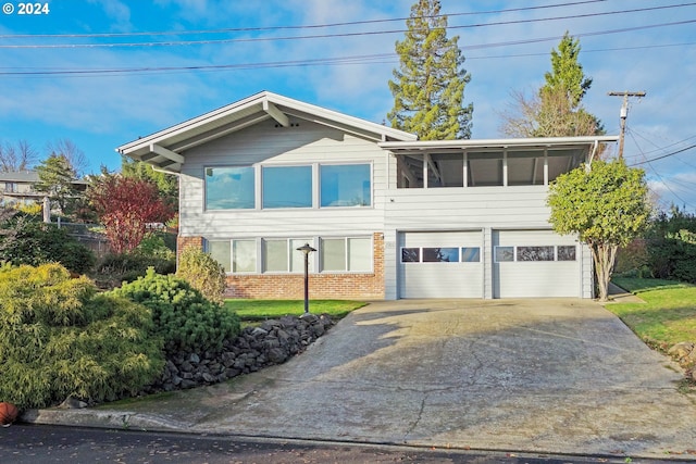 view of front of property with a sunroom and a garage