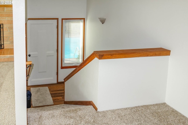 stairs featuring hardwood / wood-style flooring