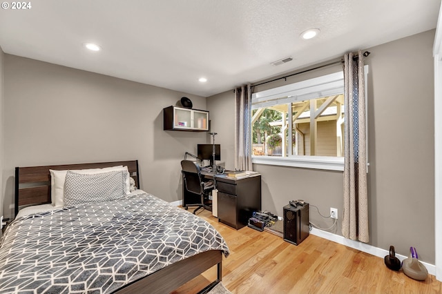 bedroom featuring light hardwood / wood-style flooring