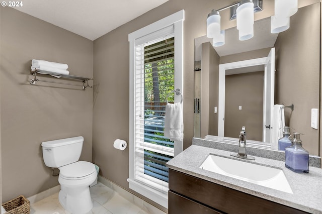 bathroom featuring toilet and vanity