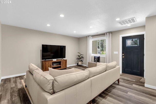 living room with light hardwood / wood-style flooring