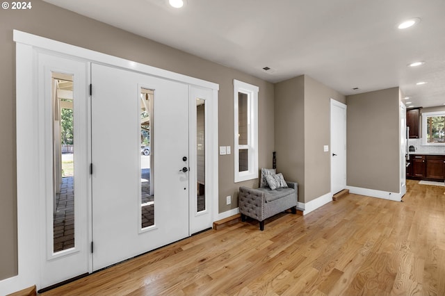 foyer with light hardwood / wood-style floors