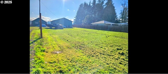 view of yard with fence