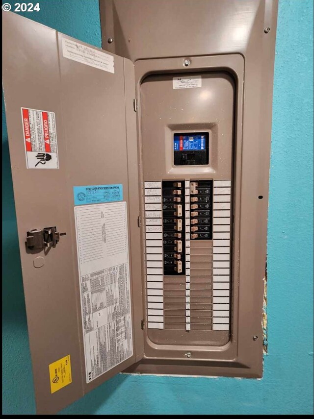 utility room featuring electric panel