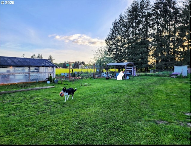 view of yard with an exterior structure and an outdoor structure