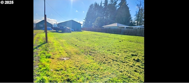 view of yard with a rural view