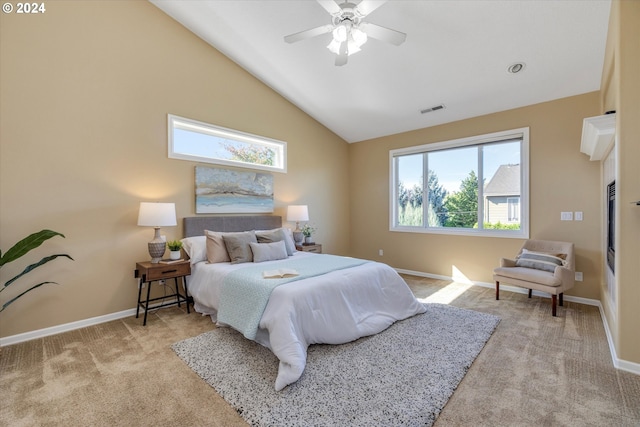 bedroom with light carpet, ceiling fan, and high vaulted ceiling