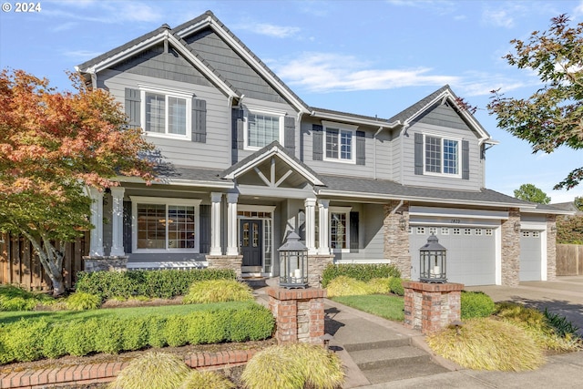 craftsman-style home with a garage and a porch