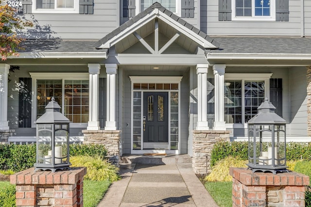 entrance to property featuring a porch