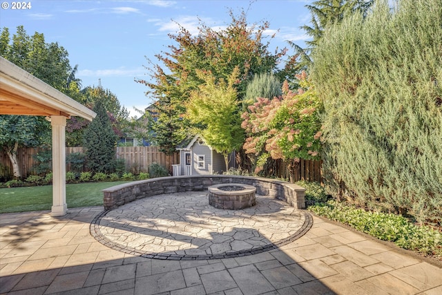 view of patio / terrace featuring an outdoor fire pit