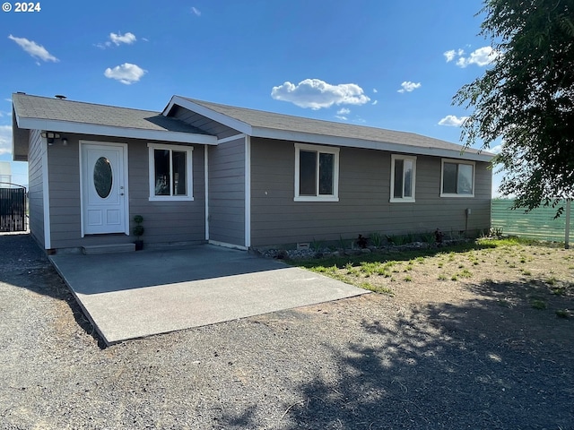 single story home with driveway, a patio area, fence, and central air condition unit