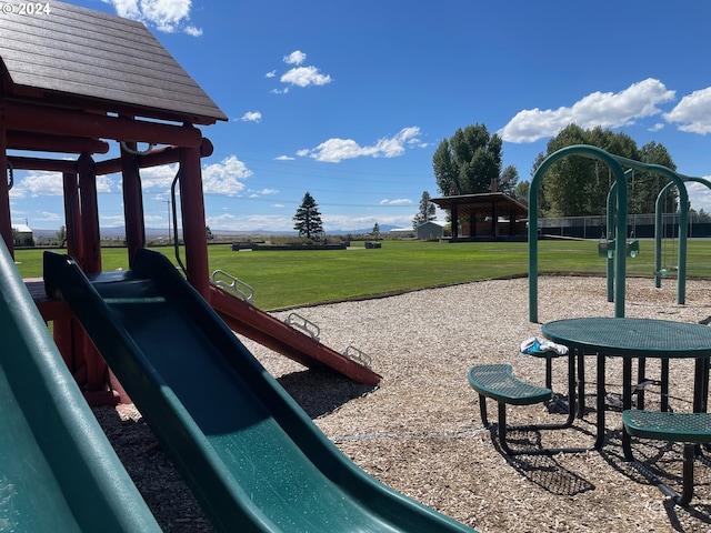 communal playground featuring a yard