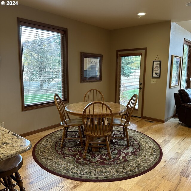 dining space featuring light hardwood / wood-style floors