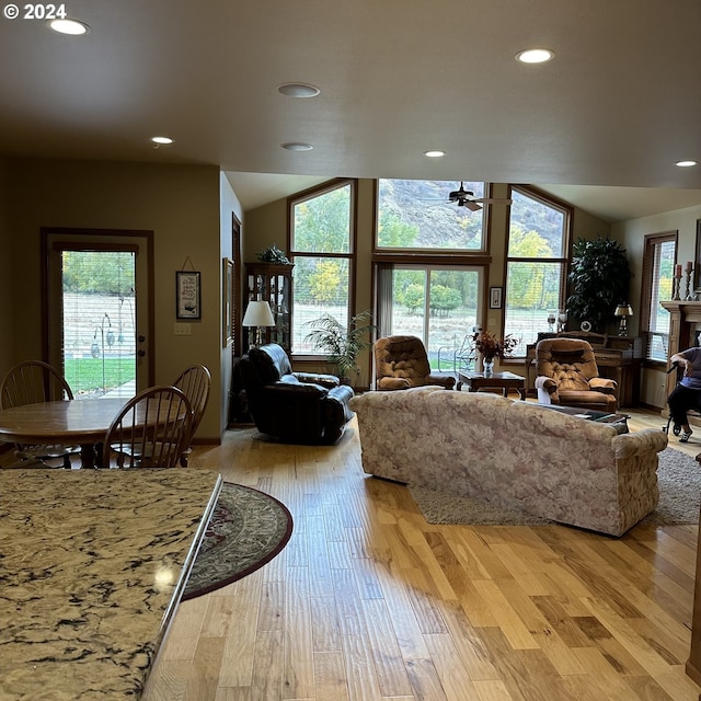 81890 S Fork Walla Walla Riv Rd, Milton-Freewater, OR 97862 - living room featuring vaulted ceiling, recessed lighting, light wood-style floors, and healthy amount of natural light