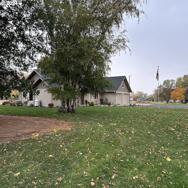 exterior space featuring a front yard and a garage