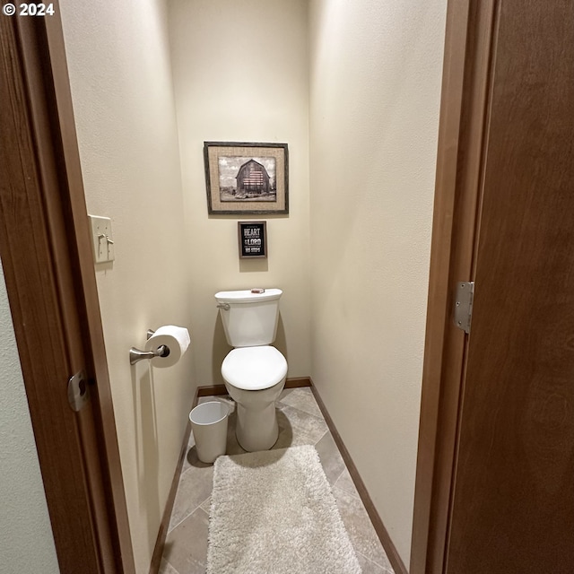 81890 S Fork Walla Walla Riv Rd, Milton-Freewater, OR 97862 - bathroom featuring toilet, baseboards, and tile patterned flooring
