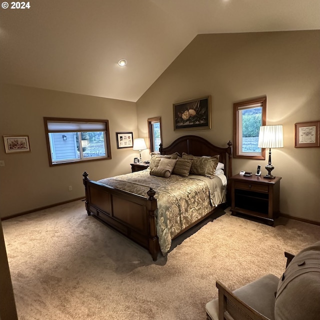 carpeted bedroom featuring lofted ceiling