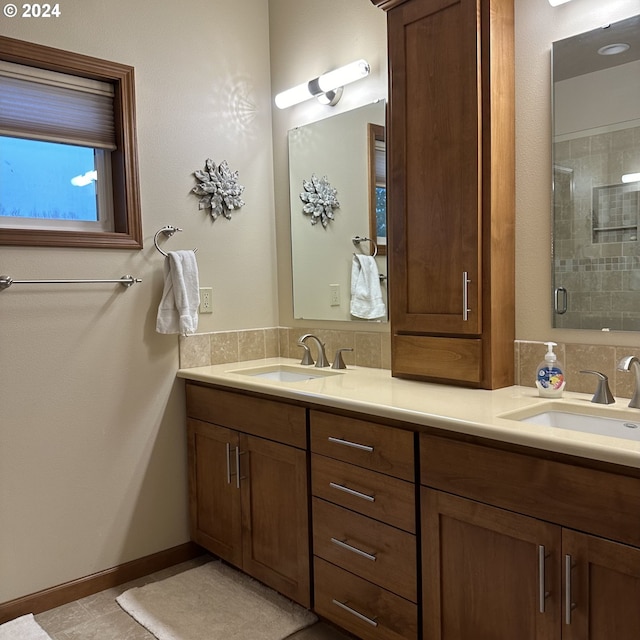 bathroom with tile patterned floors, vanity, and walk in shower