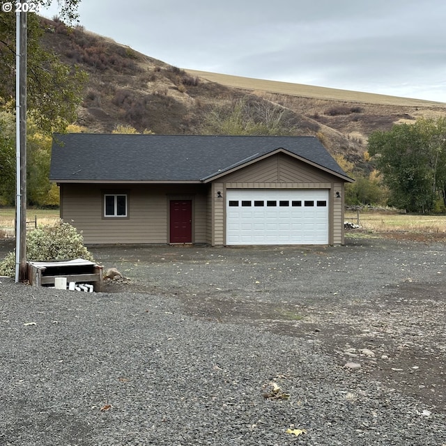 81890 S Fork Walla Walla Riv Rd, Milton-Freewater, OR 97862 - view of front of house featuring a garage, a mountain view, and a shingled roof