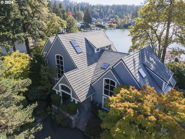 birds eye view of property with a water view