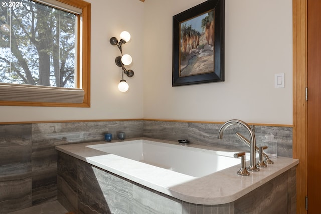 bathroom with tiled bath