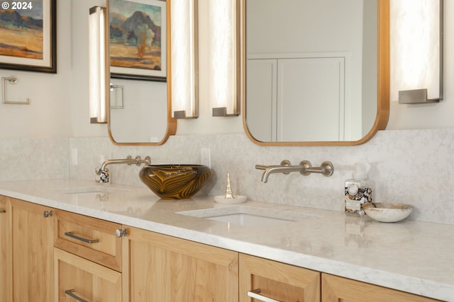 bathroom with tasteful backsplash and vanity