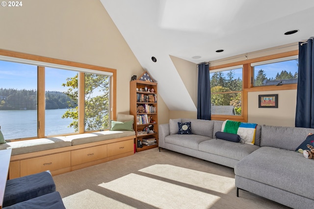 carpeted living room featuring vaulted ceiling and a water view