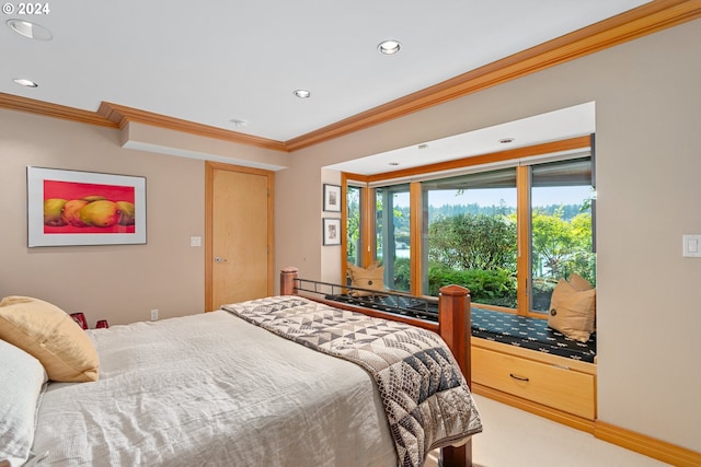 carpeted bedroom featuring crown molding