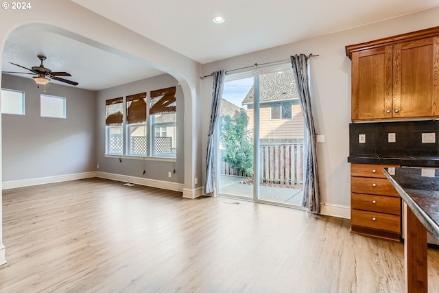 doorway to outside featuring light hardwood / wood-style floors and ceiling fan