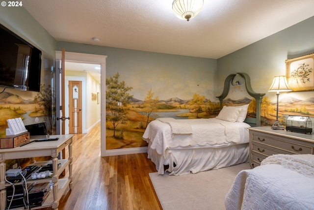 bedroom with light hardwood / wood-style floors