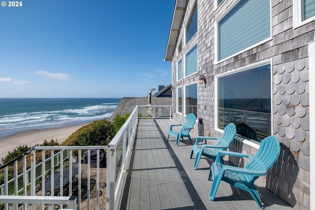 balcony with a view of the beach and a water view